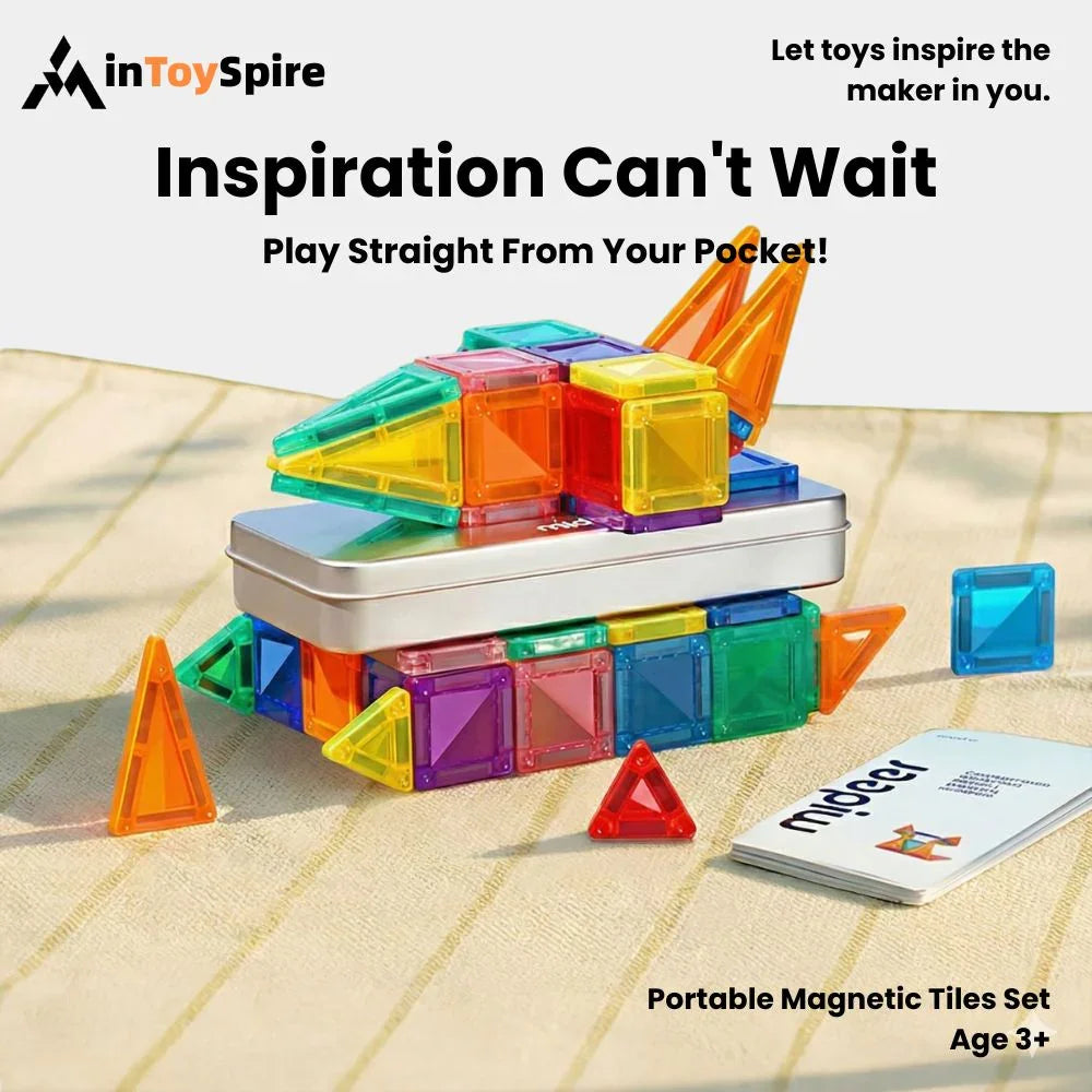 Portable magnetic tiles set on a striped surface with colorful geometric shapes and a small metal case